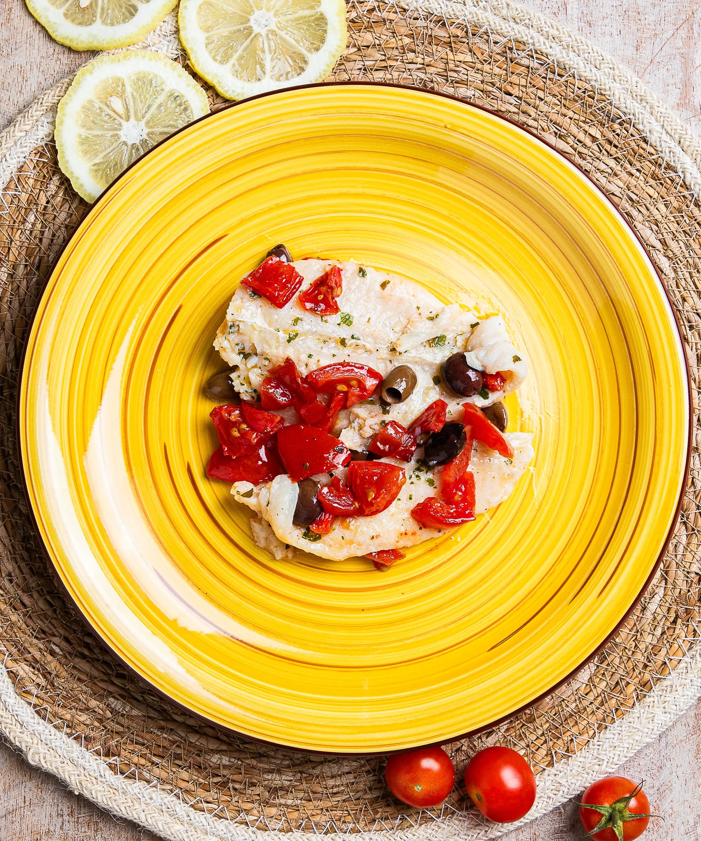 Filetto di Pesce Primavera con Olive taggiasche, capperi e Pomodorini
